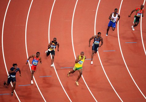 Photos Usain Bolt [Jamaïque] en tête du 200 mètres, photographie de Jérôme Prevost, 2008.
